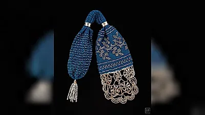 “怎么取出硬币？”被称为吝啬鬼钱包的手工艺品，“Miser’s purse”